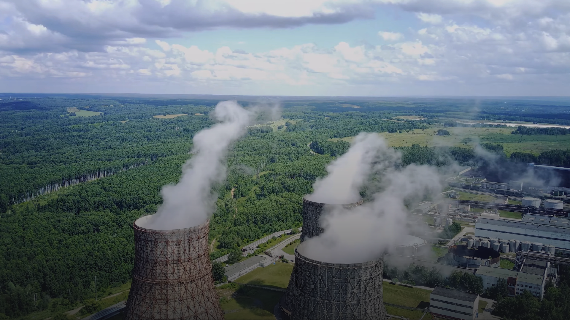 Power plants emitting smoke into the air.