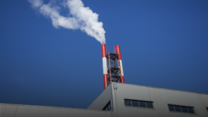 Two chimneys emitting smoke, used to represent carbon emissions.