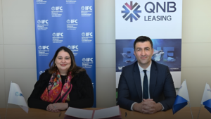 Image of officials from IFC and QNB Leasing.